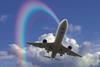 Aeroplane in the sky with rainbow