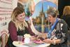 Exhibitors talk to visitors at the Group Leisure & Travel Show