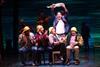 Some of the cast from the Come from Away musical pictured on stage during one of the scenes.