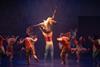 Some of the cast of Sadler's Wells' Message In A Bottle dance show seen on the stage.