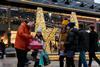 A group of shoppers looking pleased with their purchases while shopping in Lincoln