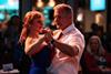 A couple dancing together at a Warner Hotel