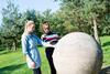 Faye Brant-Key, who looks after groups, at the National Memorial Arboretum with a colleague touching one of the memorials