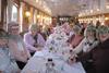 Group members wear their festive glasses on board The Georgian boat in Windsor for a Christmas lunch and cruise