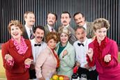 Characters from the Faulty Towers Dining Experience in London