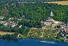 Scenic Gem cruise ship sails past Château La Roche-Guyon in France
