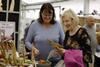 Visitors look at some of the items for sale at the Living Crafts festival in Hertfordshire