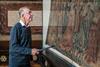 A man admires a remarkable tapestry at St Mary's Guildhall in Coventry