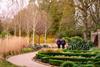 Two people exploring Wakehurst Winter Garden