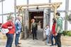 A group have a tour of Shakespeare's Globe