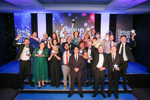 The winners of the 2024 GLT Awards show off their trophies with host Pete Firman
