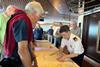 Cruise passengers look at navigational maps during Fred. Olsen Cruise Lines' behind the scenes tours